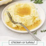 gluten-free gravy over mashed potatoes on a white plate