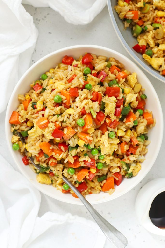 gluten-free fried rice with colorful veggies on a white bowl