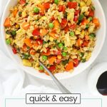 fried rice with gluten-free tamari, veggies, and eggs in a white bowl