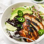 honey lime chicken burrito bowl with black beans, cilantro lime rice and avocado