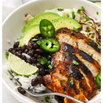 honey lime chicken burrito bowl with avocado, cilantro lime rice, and black beans