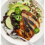 honey lime chicken burrito bowl with avocado, cilantro lime rice, and black beans