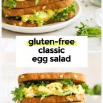 two gluten-free egg salad sandwiches stacked on a white plate