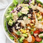 BBQ chicken salad with black beans, corn, tomatoes, avocado, red onion, and cilantro