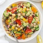 white serving bowl of vegan Greek quinoa salad