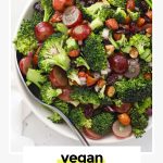 a white bowl of vegan broccoli salad