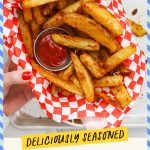A basket of golden brown crispy oven fries with ketchup