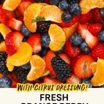 Close up look at orange berry fruit salad with fresh mint