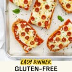 Slices of gluten-free French bread pizza on a sheet pan