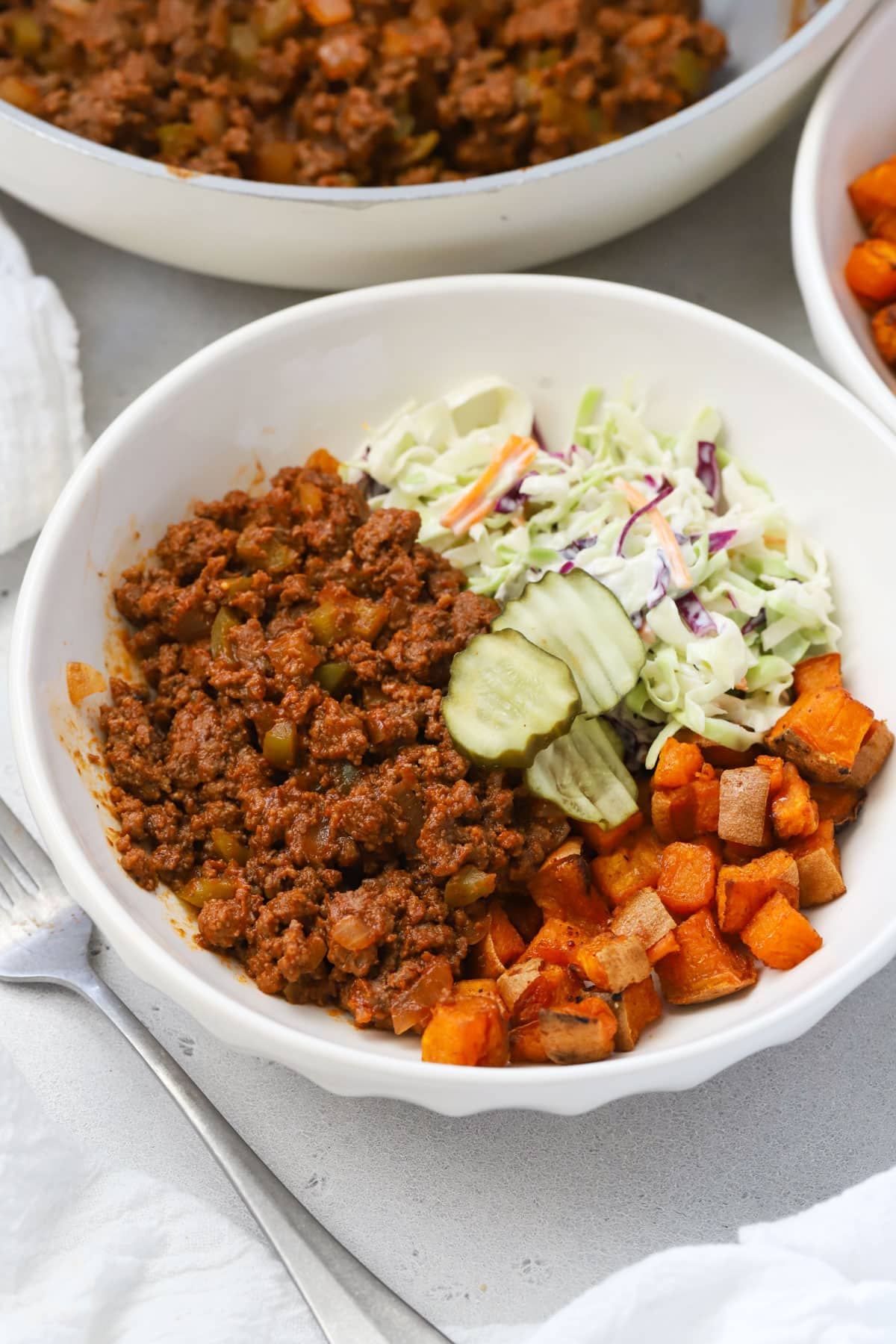 Sweet potato sloppy joe bowls with coleslaw and pickles