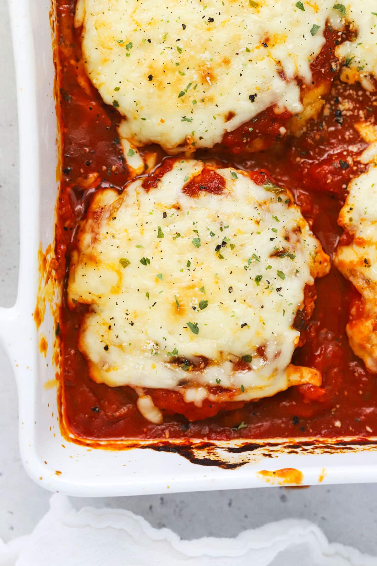 Chicken parmesan burgers covered with melty mozzarella cheese