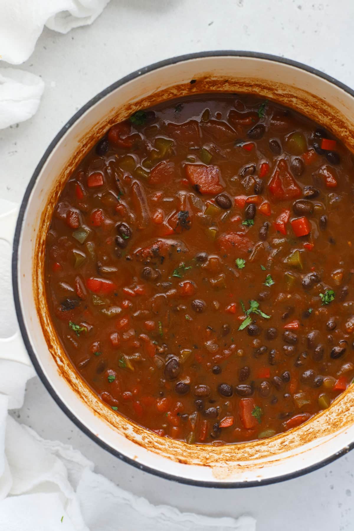 A white pot of vegetarian black bean chili