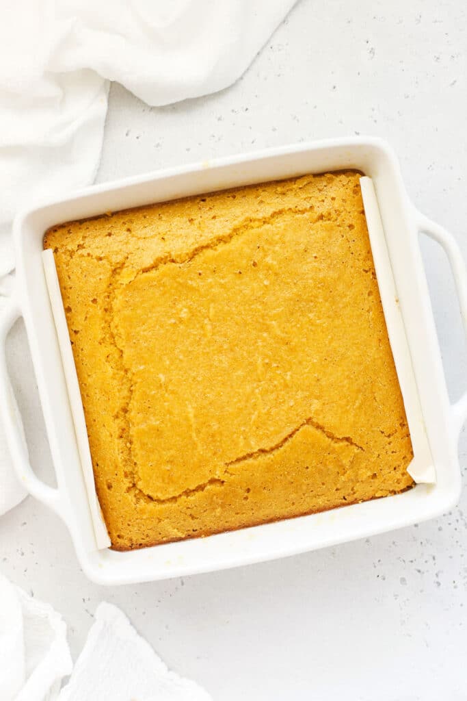 A pan of gluten-free maple cornbread brushed with maple butter
